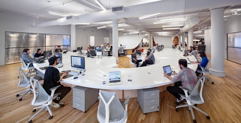 Illustration for article titled This gorgeous office has an endless desk made by robots